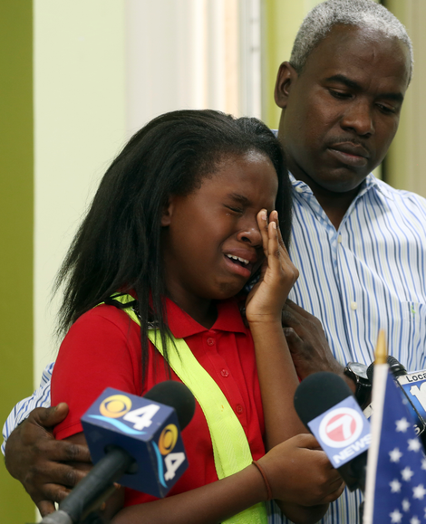 Ronyde Ponthieux, 10, cries as she talks about her family’s immigration status at a news conference in Miami. Photo: AP